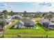 Beautiful aerial view of a well-maintained single Gathering home featuring a screened-in pool and mature landscaping at 119 Fairway Rd, Rotonda West, FL 33947