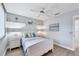 Well-lit bedroom with a coastal theme, featuring a queen-sized bed and tasteful nautical decor at 119 Fairway Rd, Rotonda West, FL 33947
