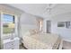 Comfortable bedroom featuring a queen bed with soft lighting at 119 Fairway Rd, Rotonda West, FL 33947