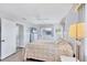Bright bedroom with a queen bed and windows offering tranquil views at 119 Fairway Rd, Rotonda West, FL 33947
