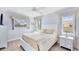 Bright bedroom with a queen bed and windows for natural light and nice views at 119 Fairway Rd, Rotonda West, FL 33947