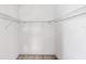 Spacious walk-in closet featuring white walls and metal shelving for ample storage at 119 Fairway Rd, Rotonda West, FL 33947