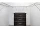 Walk-in closet with a dark wooden dresser and adjustable wire shelving at 119 Fairway Rd, Rotonda West, FL 33947