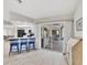 Bright kitchen featuring a breakfast bar, open layout, and sliding doors to the outdoor patio at 119 Fairway Rd, Rotonda West, FL 33947