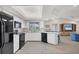 Open kitchen offers white cabinets, modern appliances, and a view into the adjacent living area at 119 Fairway Rd, Rotonda West, FL 33947