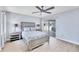 Comfortable main bedroom with a ceiling fan, sliding doors to the patio, and neutral furnishings at 119 Fairway Rd, Rotonda West, FL 33947