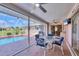 Screened-in pool with a view of the landscaped yard at 119 Fairway Rd, Rotonda West, FL 33947
