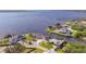 Stunning aerial view of the waterfront neighborhood with beautiful waterways, docks, and lush landscaping at 12445 Krome Ave, Port Charlotte, FL 33981