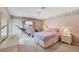 Well-lit bedroom with floral wallpaper, a double bed and a window at 12445 Krome Ave, Port Charlotte, FL 33981