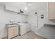 Functional laundry room with washer, dryer, sink and storage at 12445 Krome Ave, Port Charlotte, FL 33981