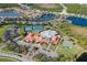Stunning aerial view of the community's pool, tennis courts, clubhouse, and bocce ball area at 1318 Ballota Ln, North Port, FL 34289