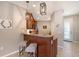 Breakfast bar with pendant lighting and granite countertops adjacent to the kitchen at 1318 Ballota Ln, North Port, FL 34289
