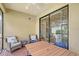 Enclosed patio featuring neutral tones, a ceiling fan, and a table with chairs at 1318 Ballota Ln, North Port, FL 34289