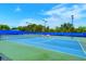 Community tennis courts with new nets and lush landscaping at 1318 Ballota Ln, North Port, FL 34289