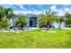 Charming single story home featuring decorative stone accents and a lush green lawn at 13348 Boabadilla Ln, Port Charlotte, FL 33981
