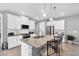 Modern kitchen featuring an island with bar seating and stainless steel appliances at 13348 Boabadilla Ln, Port Charlotte, FL 33981