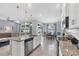 Stylish kitchen with granite countertops and a view into the living and dining spaces at 13348 Boabadilla Ln, Port Charlotte, FL 33981