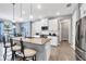 Bright, contemporary kitchen features a center island and stainless steel appliances at 13348 Boabadilla Ln, Port Charlotte, FL 33981
