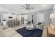Open concept living space with bar seating looking into the modern kitchen at 13348 Boabadilla Ln, Port Charlotte, FL 33981