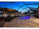 Enclosed pool area with modern patio, lounge chairs, and serene outdoor ambiance at 13348 Boabadilla Ln, Port Charlotte, FL 33981