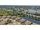Beautiful aerial view of a residential community with water features and well-manicured landscaping at 1339 Backspin Dr, Englewood, FL 34223