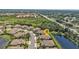Aerial view showing the home's location with pond and wooded area nearby at 1339 Backspin Dr, Englewood, FL 34223