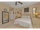 Cozy bedroom with neutral colors, a ceiling fan, and comfortable furniture at 1339 Backspin Dr, Englewood, FL 34223