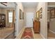 Inviting entryway with tile flooring, wooden furniture, and view to living space at 1339 Backspin Dr, Englewood, FL 34223