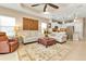 Inviting living room with open layout, comfortable seating, and seamless flow to the kitchen at 1339 Backspin Dr, Englewood, FL 34223