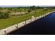 Aerial view of the community walkway and waterfront, highlighting the beautiful waterfront location and amenities at 15092 Chinook Way, Port Charlotte, FL 33981