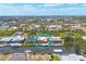 Aerial view of waterfront home, dock and boat lift in a canal community at 15092 Chinook Way, Port Charlotte, FL 33981