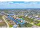 Aerial view of a beautiful home with waterfront access on a canal community at 15092 Chinook Way, Port Charlotte, FL 33981