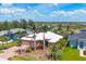 Aerial view of lovely home in a waterfront community surrounded by lush green landscaping at 15092 Chinook Way, Port Charlotte, FL 33981