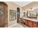 Vanity with granite countertop, sink, and tiled walk-in shower with mosaic tile ceiling at 15092 Chinook Way, Port Charlotte, FL 33981