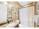 Bathroom featuring granite countertops, modern fixtures and a tub/shower combo at 15092 Chinook Way, Port Charlotte, FL 33981