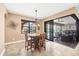Dining Area with seating for four next to sliders to the outdoor living area and pool at 15092 Chinook Way, Port Charlotte, FL 33981