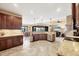 Spacious kitchen with granite countertops, tile floors, stainless steel appliances and connected living area at 15092 Chinook Way, Port Charlotte, FL 33981