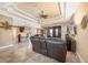 Open-concept living area with tile flooring, a decorative ceiling, and access to the lanai at 15092 Chinook Way, Port Charlotte, FL 33981