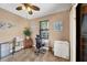 Office area with tile flooring, a ceiling fan, and a desk with a chair at 15092 Chinook Way, Port Charlotte, FL 33981