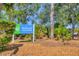 Community park sign amidst a lush green area, inviting residents to enjoy outdoor recreation and relaxation at 15092 Chinook Way, Port Charlotte, FL 33981