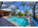 Enclosed pool area with a covered patio and beautiful canal views at 15092 Chinook Way, Port Charlotte, FL 33981