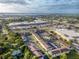 Expansive aerial view showcasing the community, nearby shopping, and waterfront access at 1531 Placida Rd # 4-103, Englewood, FL 34223
