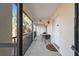Covered balcony with seating area and a view, perfect for outdoor dining at 1531 Placida Rd # 4-103, Englewood, FL 34223
