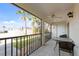 Covered outdoor patio with table and chairs featuring views of the property at 1531 Placida Rd # 4-103, Englewood, FL 34223