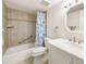 Bathroom with a shower-tub combo with tiled walls and a single vanity at 1531 Placida Rd # 4-103, Englewood, FL 34223