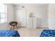 Bedroom with a chest of drawers, accent chair and natural light from a window at 1531 Placida Rd # 4-103, Englewood, FL 34223