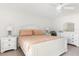 Well-lit bedroom with neutral walls, tile floors, and a matching dresser set at 1531 Placida Rd # 4-103, Englewood, FL 34223