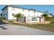 Welcoming Palm Manor sign surrounded by lush landscaping and well-maintained buildings at 1531 Placida Rd # 4-103, Englewood, FL 34223