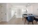 Dining room with ceiling fan and access to kitchen at 1531 Placida Rd # 4-103, Englewood, FL 34223