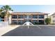 Inviting condo building featuring brick accents, screened balconies, and convenient parking at 1531 Placida Rd # 4-103, Englewood, FL 34223